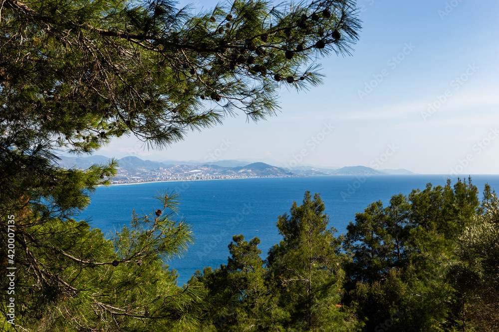 Mediterranean coastline. Blue sea, hills and clear sky.