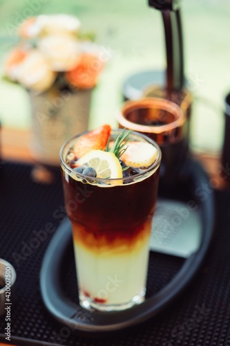 Yuzu Orange Coffee Summer drink There is a sprinkle of fruit on top of ice.