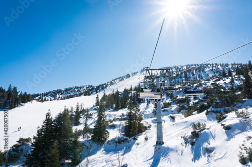 Hochkar skiing resort in Lower Austria during winter. View to the chair lift on a very sunny beautiful day.