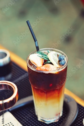 Yuzu Orange Coffee Summer drink There is a sprinkle of fruit on top of ice.