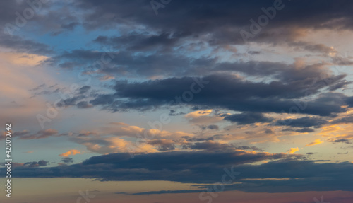 Sunset sky with dramatic clouds. Natural background. © Sergey Fedoskin