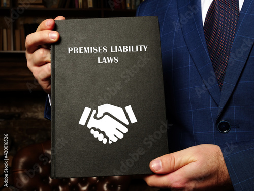Foto Lawyer holds PREMISES LIABILITY LAWS book
