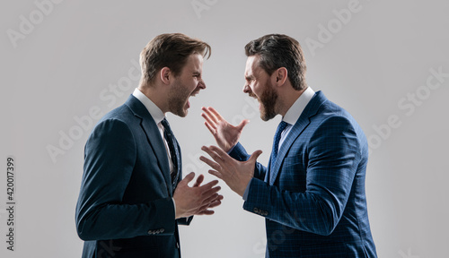 dissatisfied men discuss failure. two colleagues have disagreement and conflict. photo