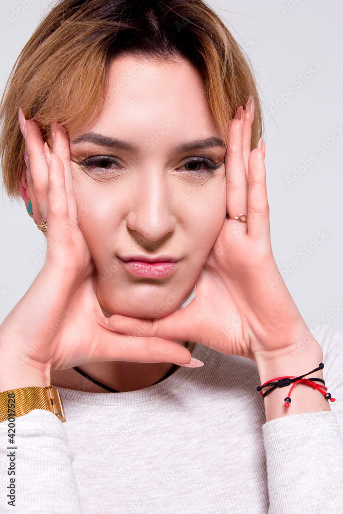 Fototapeta premium portrait of a blonde girl on a white background