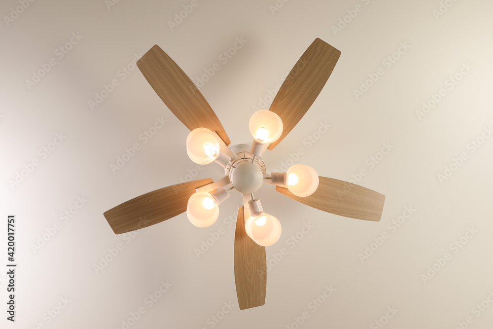 Modern ceiling fan with lamps indoors, bottom view Modern ceiling fan with lamps indoors, bottom view