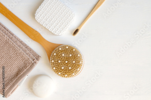 Flat lay composition with bath and skin care accessories on white background