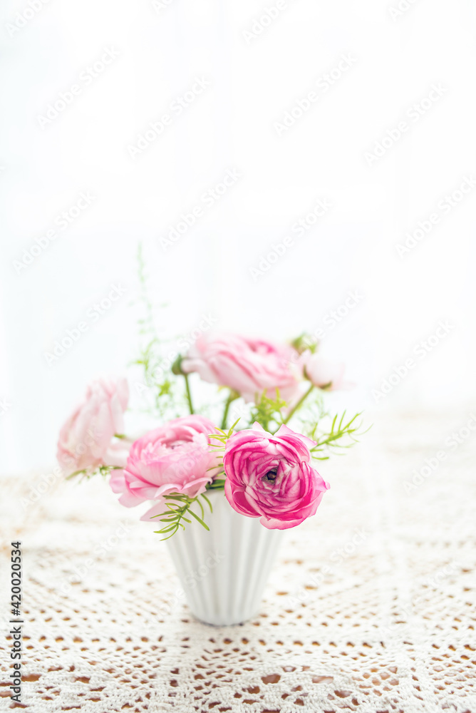 A bottle of color celery leaf peony on the desktop A bottle of color celery leaf peony on the desktop
