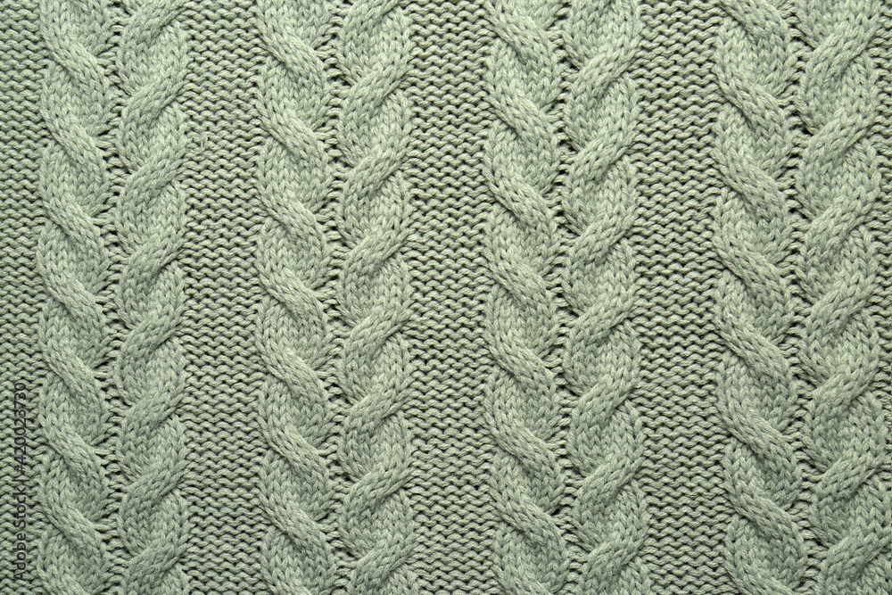 Grey knitted wool texture as background, top view Grey knitted wool texture as background, top view