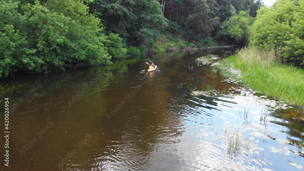 Aerial drone view of sport kayak on summer calm forest river Aerial drone view of sport kayak on summer calm forest river