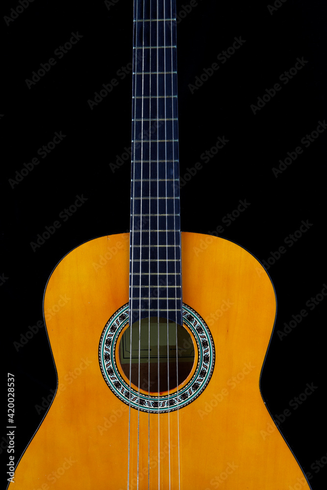 The guitar is a musical instrument that is used in a wide variety of musical styles. It typically has the six strings, but four, seven, eight, ten, and twelve string guitars also exist.