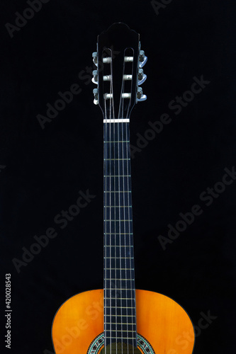 The guitar is a musical instrument that is used in a wide variety of musical styles. It typically has the six strings, but four, seven, eight, ten, and twelve string guitars also exist. photo