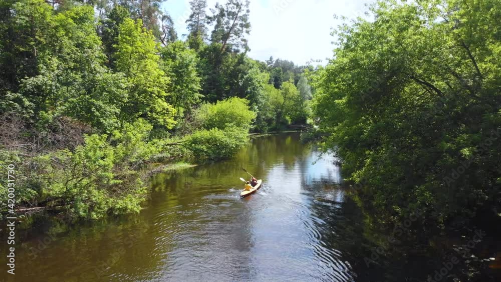Aerial drone view of sport kayak on summer calm forest river Aerial drone view of sport kayak on summer calm forest river