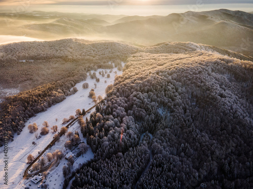 Beatiful winter landscape in Harghita, Romania from above with drone photo