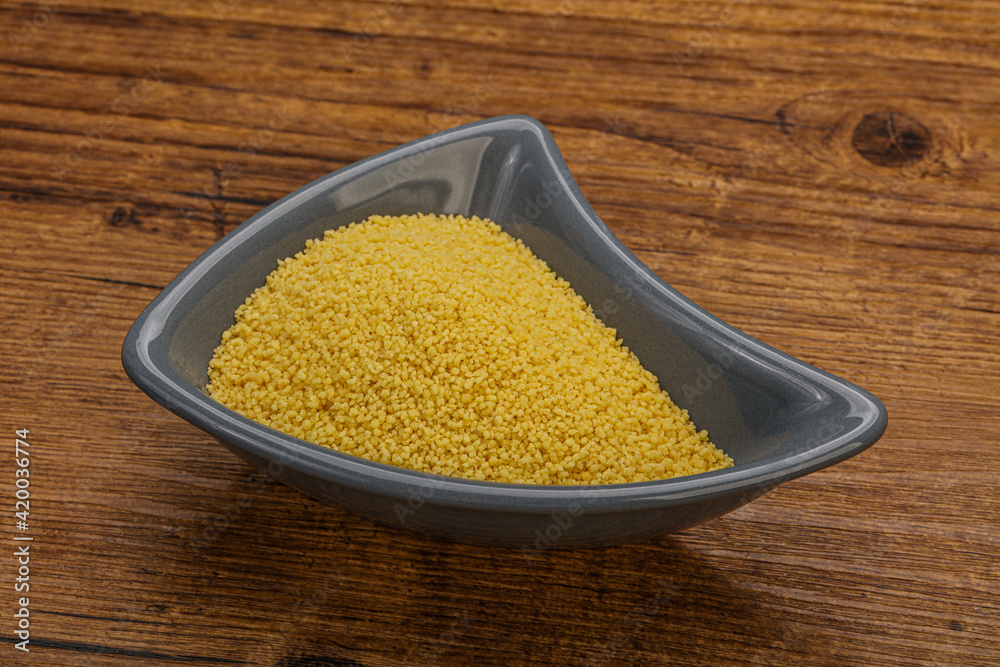 Raw cous cous heap in the bowl Raw cous cous heap in the bowl
