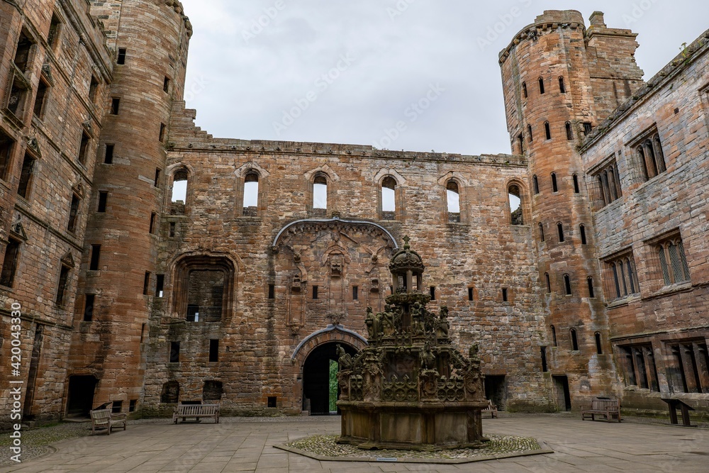 Ancient Kings Fountain in the counrtyard in Linlithgow Palace, Scotland, UK