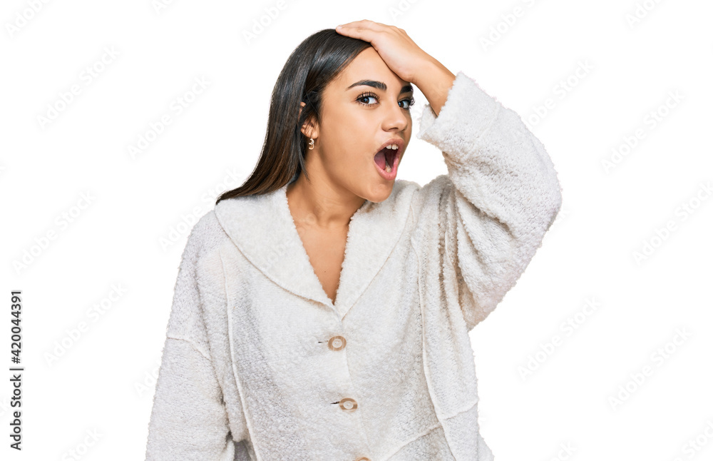 Young brunette woman wearing casual clothes surprised with hand on head for mistake, remember error. forgot, bad memory concept. Young brunette woman wearing casual clothes surprised with hand on head for mistake, remember error. forgot, bad memory concept.