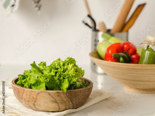 Fresh salad leaves and vegetables in the kitchen
