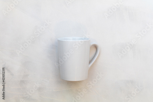 White mug mockup on gray watercolor background flat lay copy space