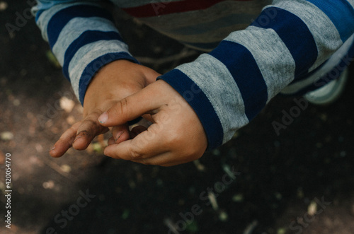 Dirty Hands of little boy. No face