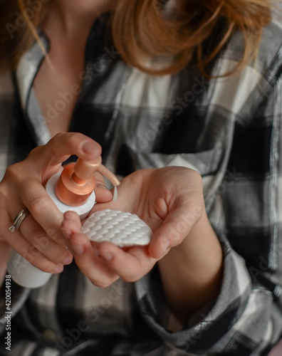 Woman with cream in hands