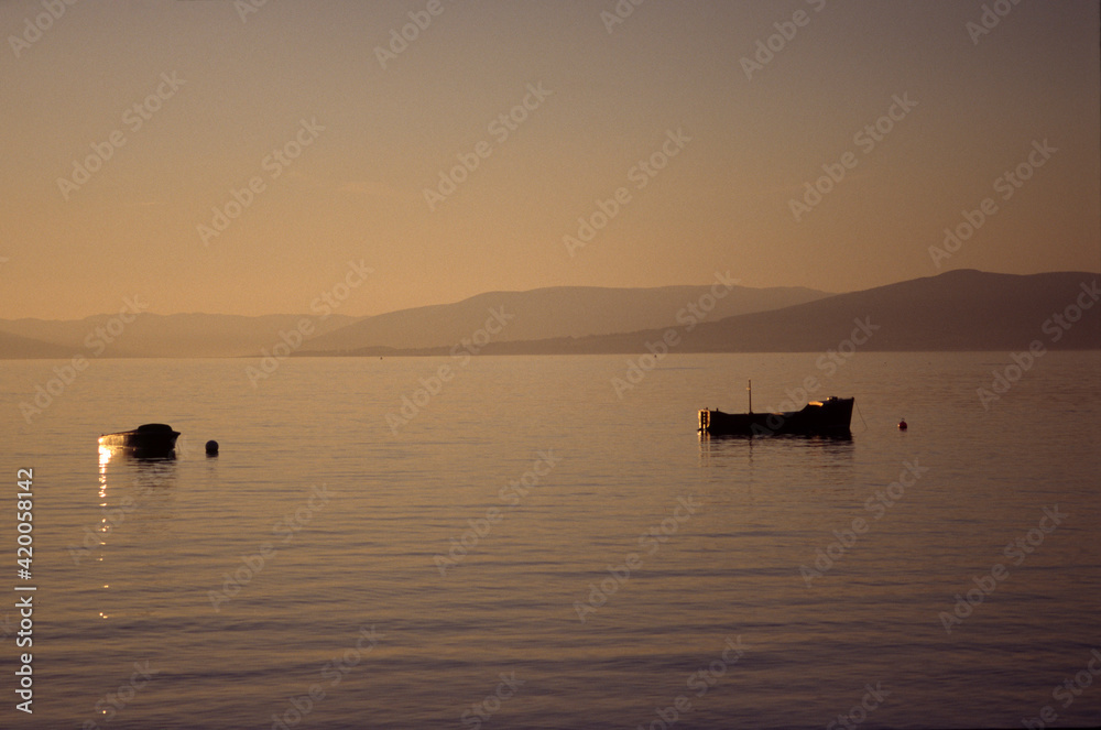 Two small boats moored off Largs on a September evening, scotland, UK, United Kingdom