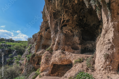 View of the Big Cave high above the narrow canyon of Nahal [stream] dry bed, east of Upper Galilee, Northern Israel, south of Lebanon border, Israel.