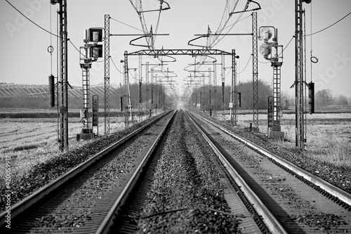 Perspective view of a railway in the countryside.