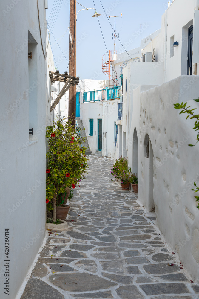 Fototapeta premium Narrow street of the old town with, Parikia, Paros Island, Greece.