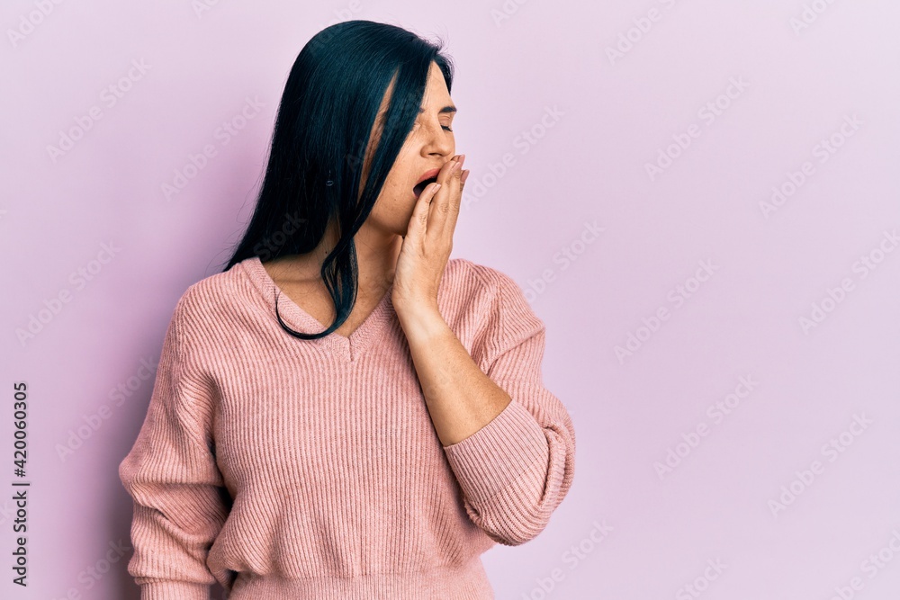 Young caucasian woman wearing casual clothes bored yawning tired covering mouth with hand. restless and sleepiness.