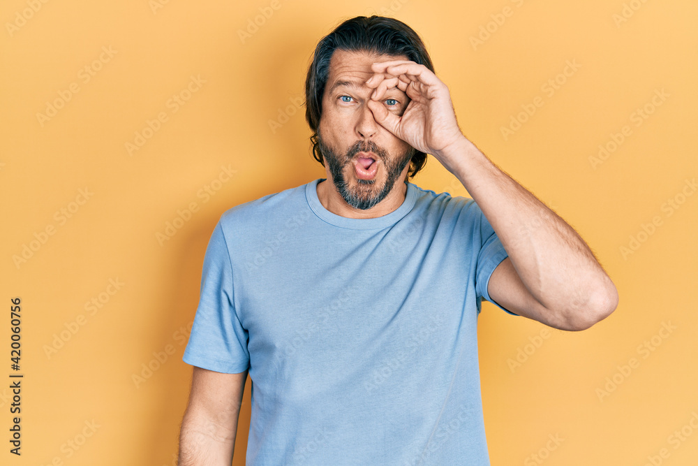 Middle age caucasian man wearing casual clothes doing ok gesture shocked with surprised face, eye looking through fingers. unbelieving expression. Middle age caucasian man wearing casual clothes doing ok gesture shocked with surprised face, eye looking through fingers. unbelieving expression.