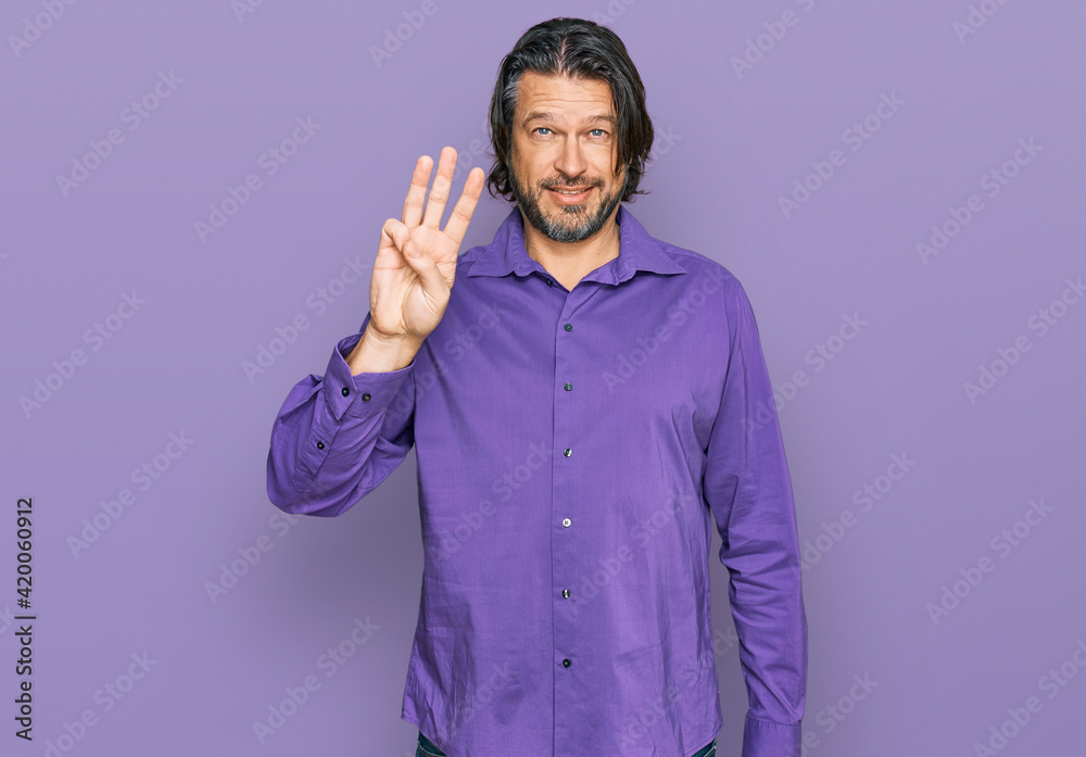 Middle age handsome man wearing business shirt showing and pointing up with fingers number three while smiling confident and happy. Middle age handsome man wearing business shirt showing and pointing up with fingers number three while smiling confident and happy.