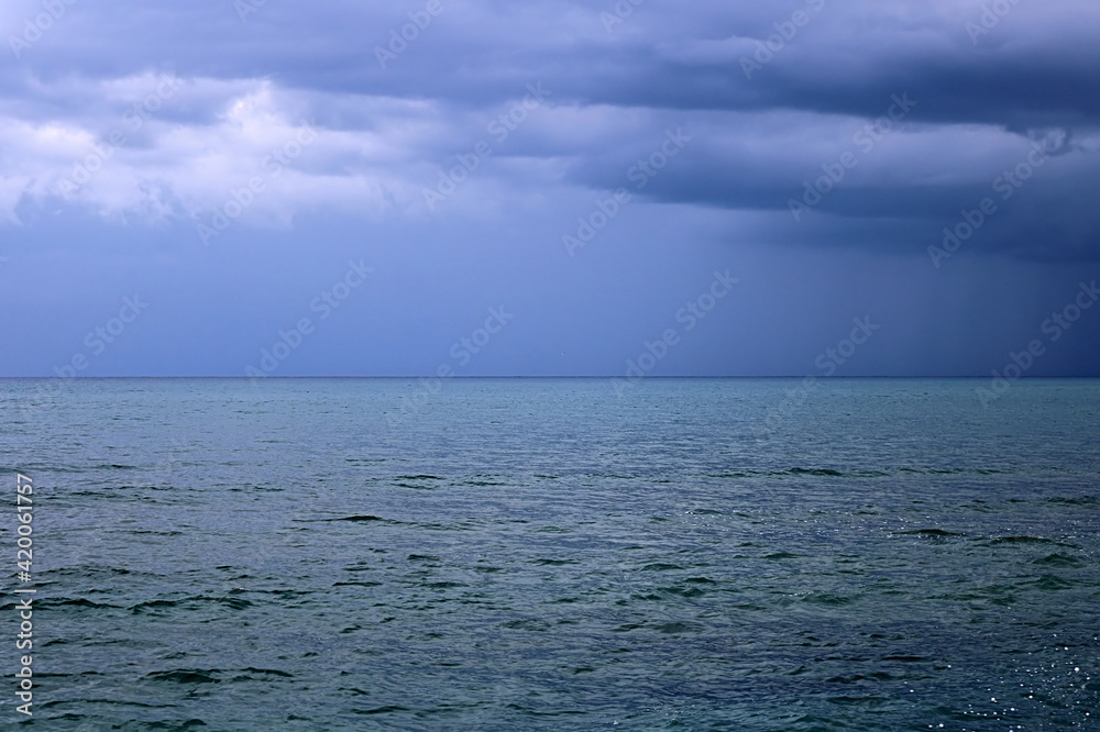 View of Mediterranean Sea with a cloudy blue sky after the rain. Waves and wind in Larnaca beach View of Mediterranean Sea with a cloudy blue sky after the rain. Waves and wind in Larnaca beach
