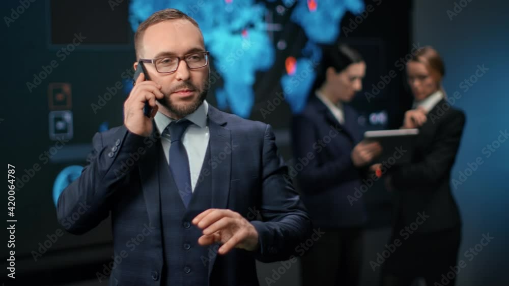 Successful businessman discussing hi tech financial investment on mobile. 4k Dragon RED camera Successful businessman discussing hi tech financial investment on mobile. 4k Dragon RED camera