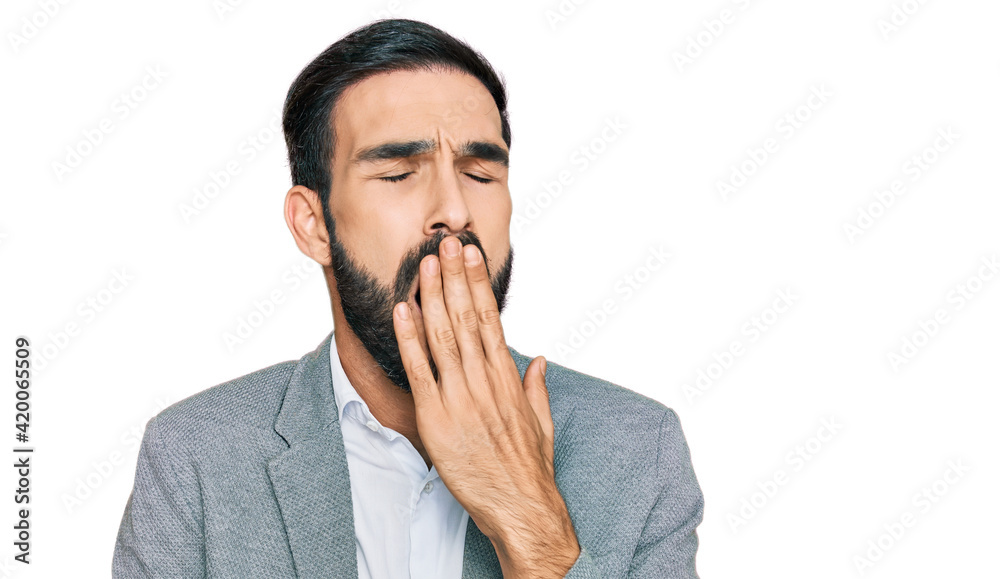 Young hispanic man wearing business clothes bored yawning tired covering mouth with hand. restless and sleepiness. Young hispanic man wearing business clothes bored yawning tired covering mouth with hand. restless and sleepiness.