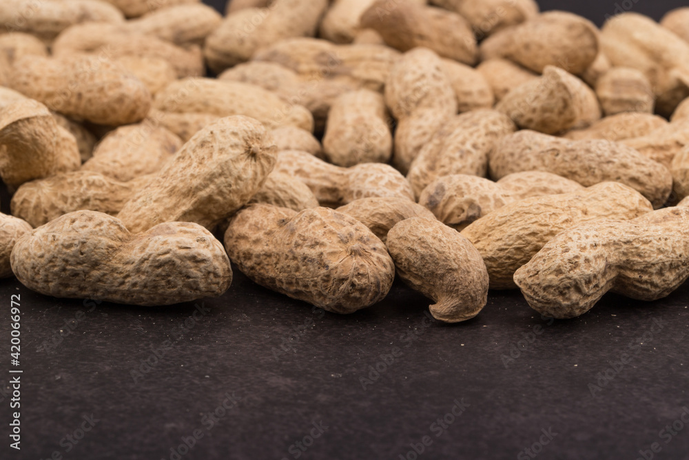 Dried peanuts with shells. Close up image. Dried peanuts with shells. Close up image.