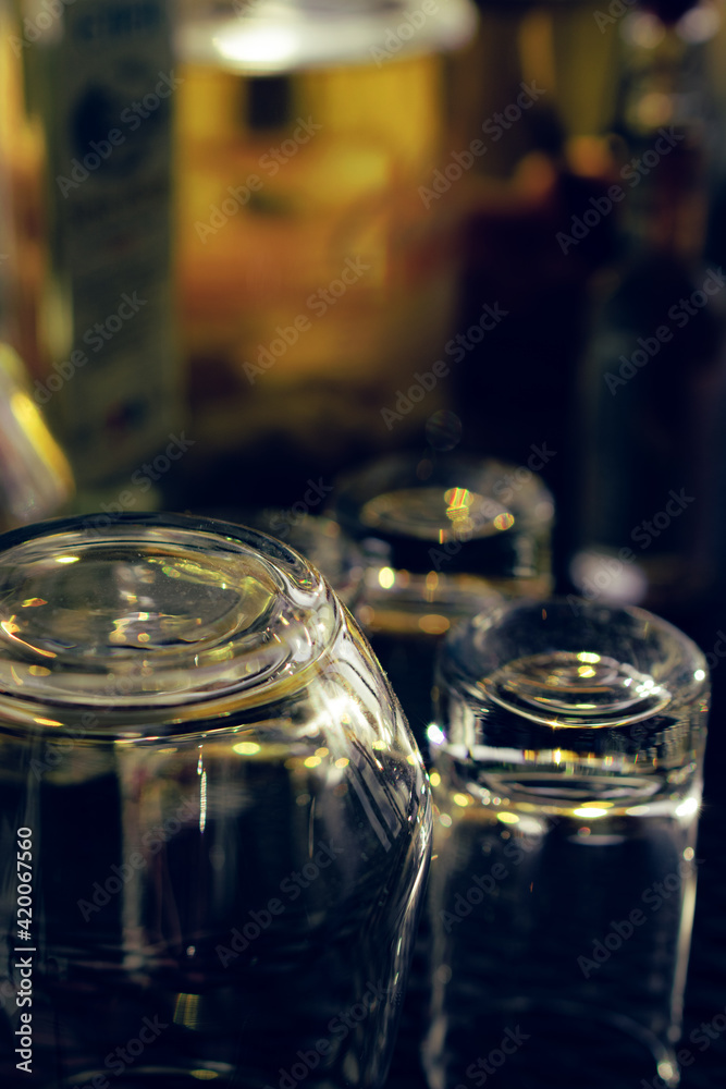 Empty alcohol glasses in front of blurry background Empty alcohol glasses in front of blurry background