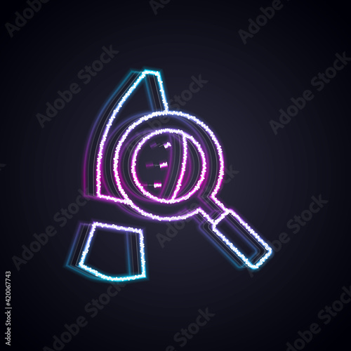 Glowing neon line Magnifying glass with footsteps icon isolated on black background. Detective is investigating. To follow in the footsteps. Vector