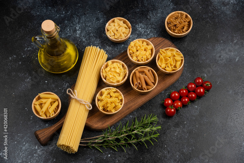 Ingredients for making pasta alla carbonara: prosciutto, raw pasta