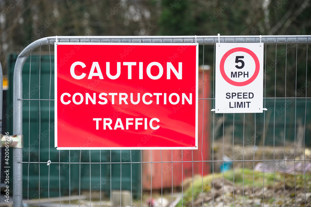 Construction site health and safety message rules sign board signage on fence boundary