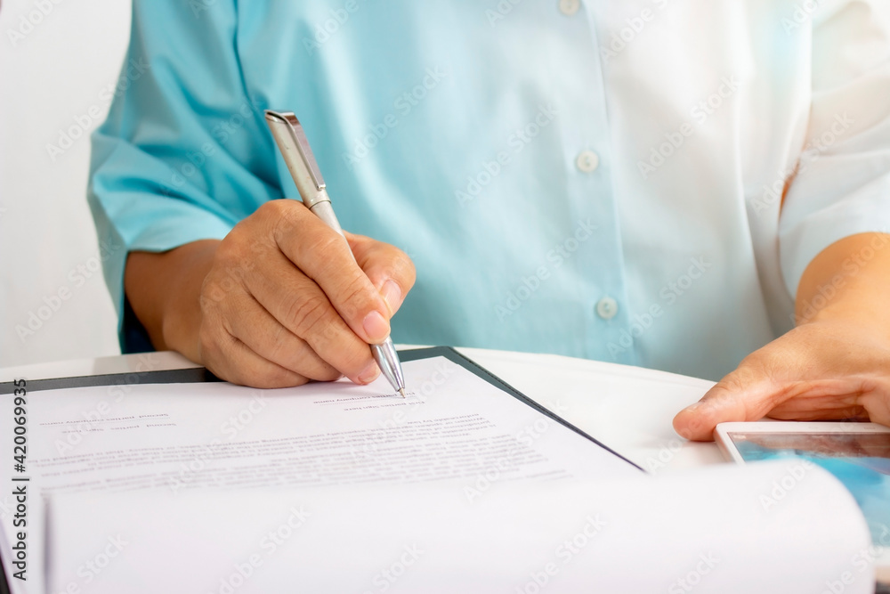 The older woman sign contract for health insurance at home The older woman sign contract for health insurance at home