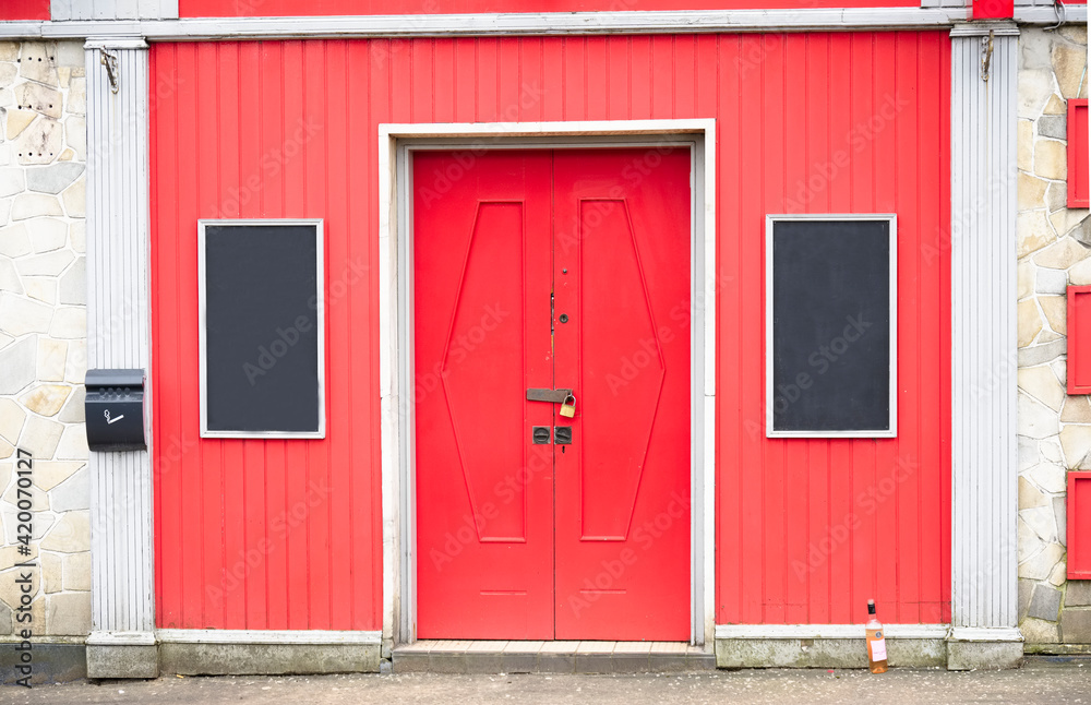 Bar lounge red with blank signs and closed shutter door