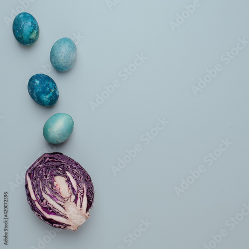 Easter eggs painted with natural dye on a light blue background
