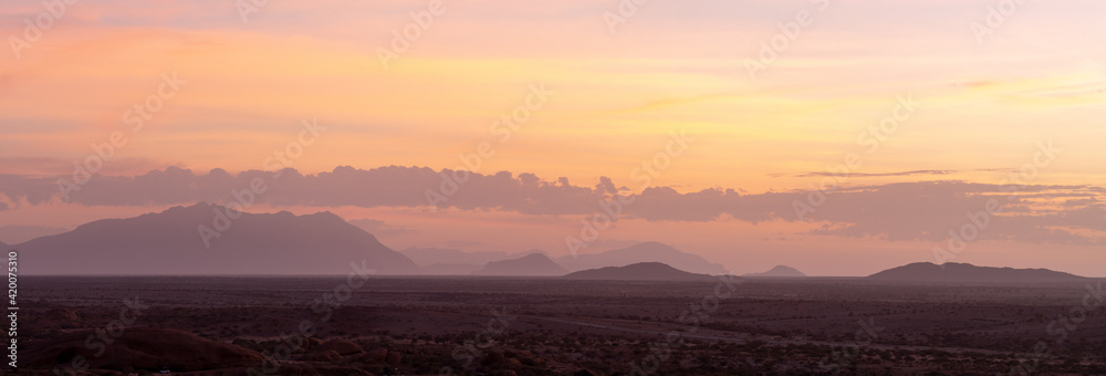 Dusty sunrise near Spitzkoppe in Namibia, Africa