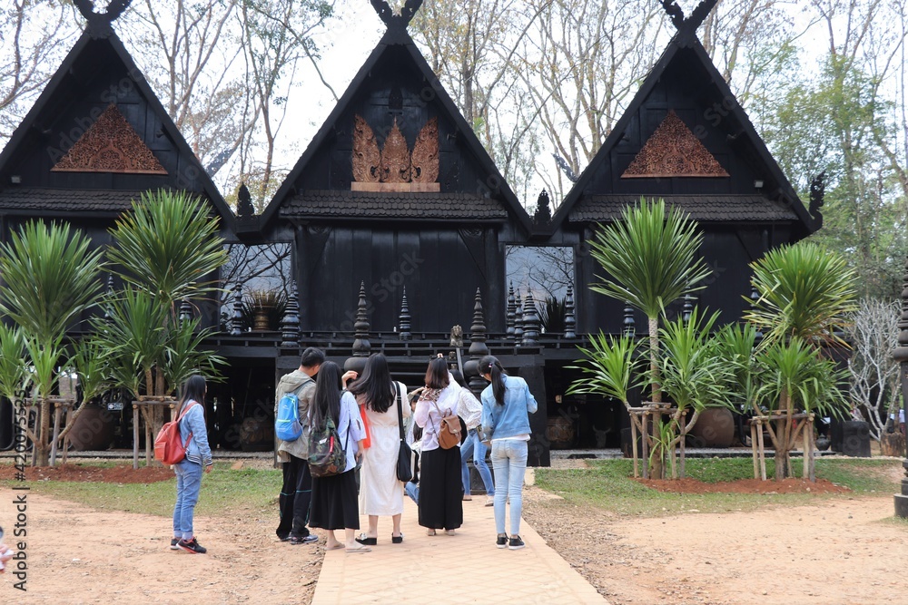 Tourists Standing on the Black Museum Grounds in Nang Lae, Chiang Rai, Thailand