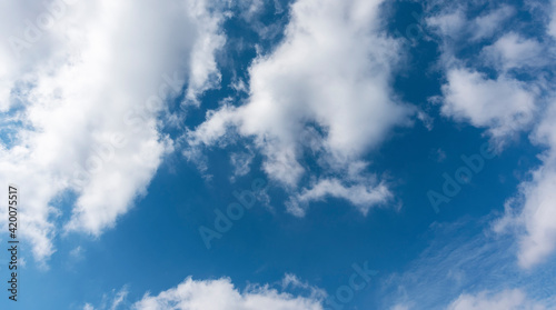 Beautiful blue sky with fluffy white clouds. Sky clouds backgrounds.