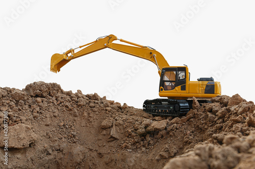 Excavators are digging the soil in the construction site with bucket lift up on white background