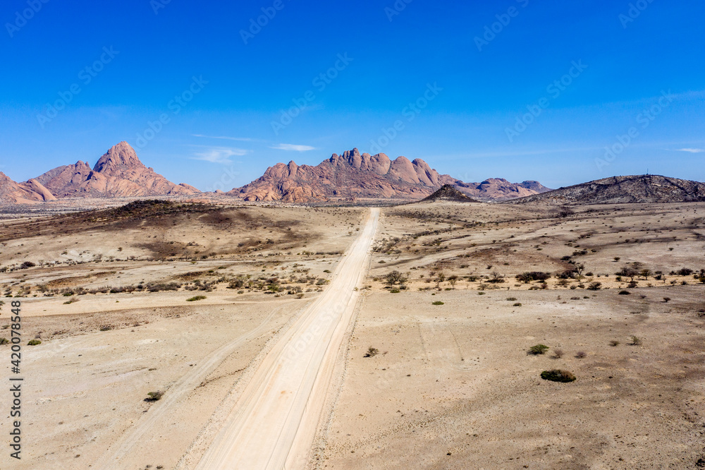 Gravel road to the mountains of spitzkoppe