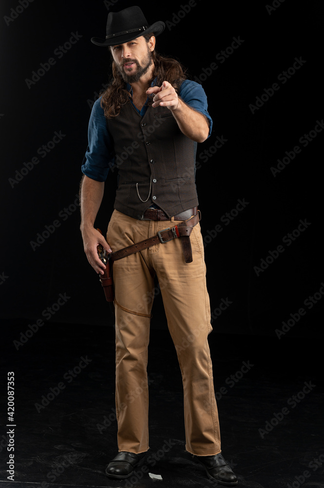 Cowboy with guns. Studio shooting Cowboy with guns. Studio shooting