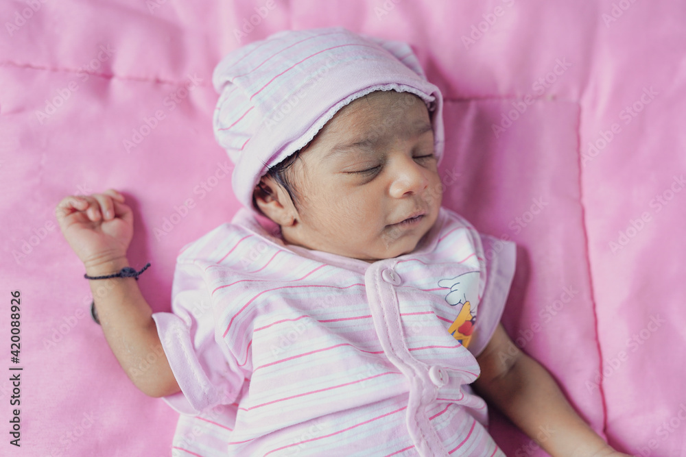 A little child is laughing while sleeping, sometimes crying A little child is laughing while sleeping, sometimes crying
