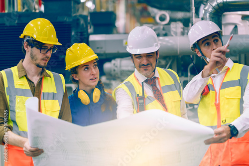 Industry engineering team having discussion work plan in the factory	